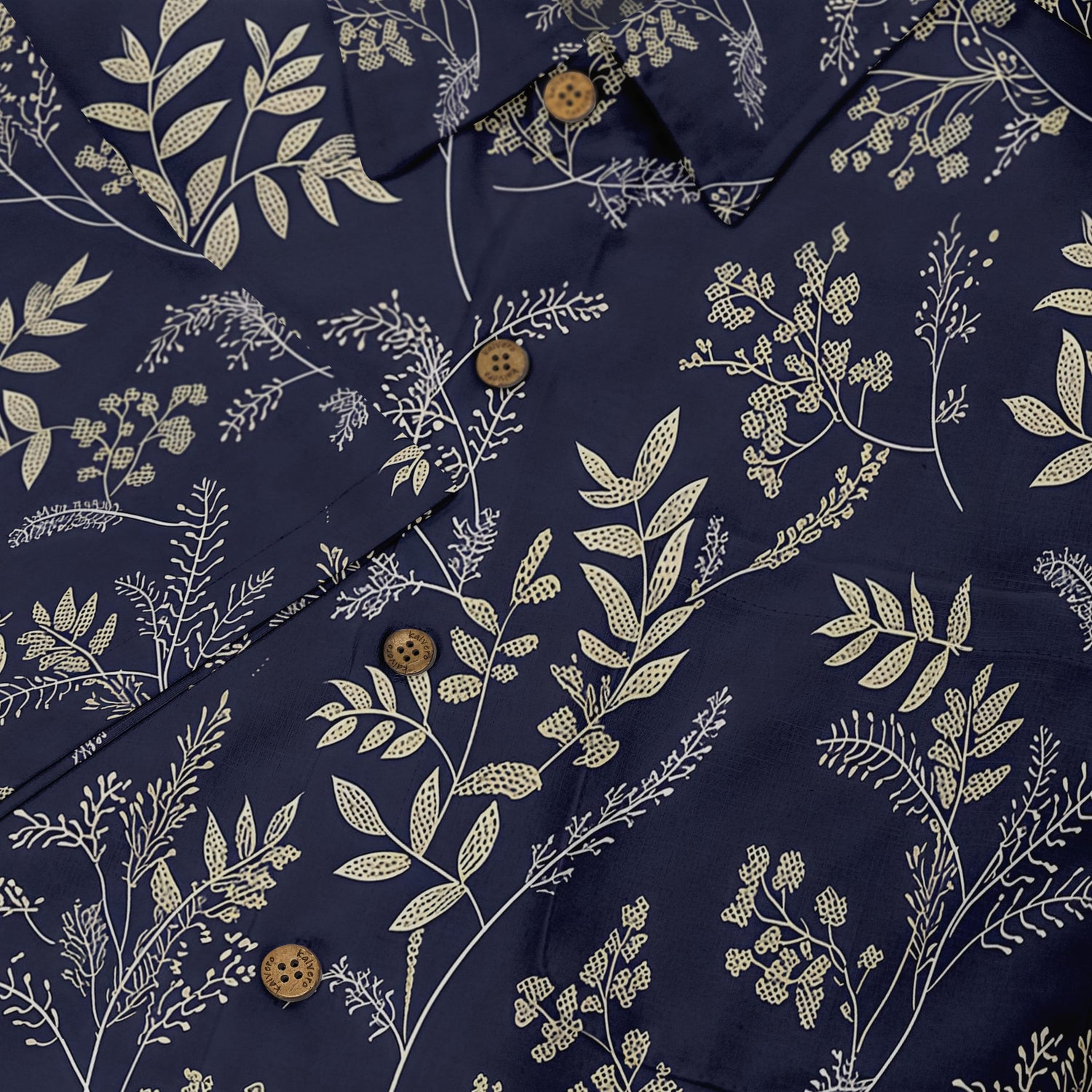 Floral and leaf patterns on a deep navy shirt, offering a serene and sophisticated look.