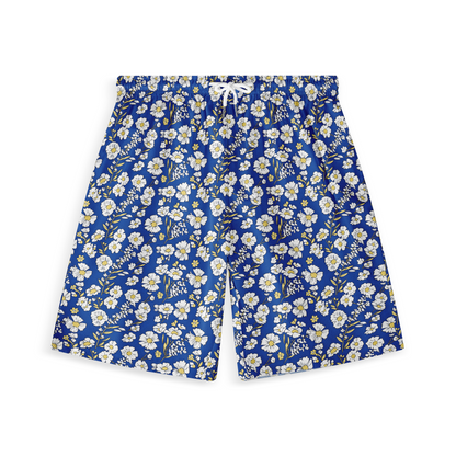 A pair of shorts featuring a design with white and yellow flowers on a vibrant blue background, creating a cheerful and lively look.