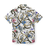 Floral shirt with gold chain accents on a white background.