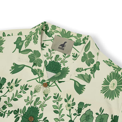 Detailed design of nature-inspired green florals and serene birds on a shirt.