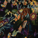 This image shows a close-up of the shirt’s buttons, featuring vibrant flowers, birds, and a leopard in the design.