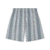 A pair of shorts featuring a vertical stripe design with intricate scrolling patterns and geometric accents in shades of blue and gray, creating an elegant and serene visual effect.