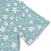 Light blue short-sleeved shirt with whimsical white stars.