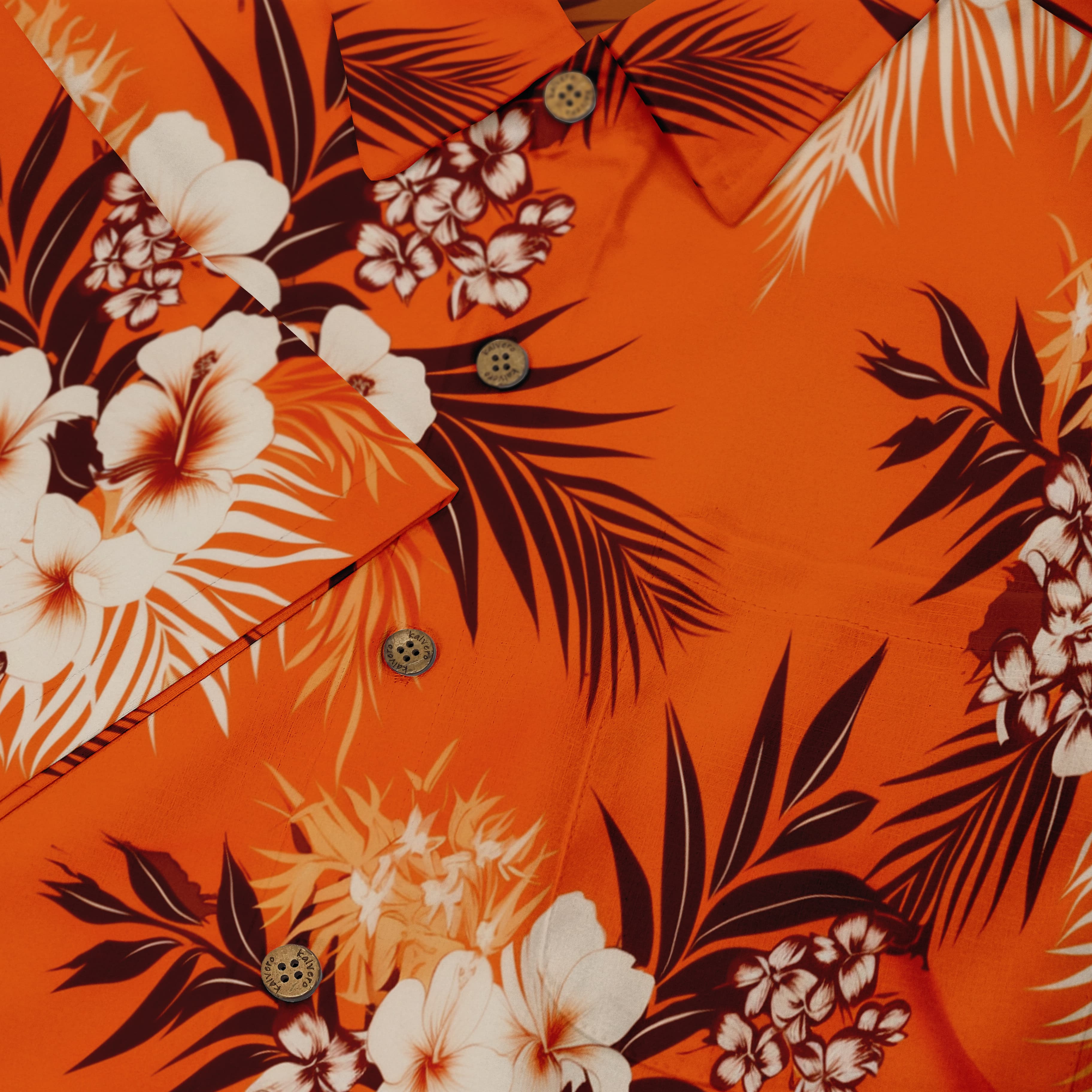 Hawaiian shirt featuring lush tropical blooms on a bright orange background.