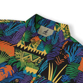 A bold shirt design featuring abstract shapes and lush tropical leaves.