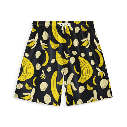 Front view of black shorts featuring a playful banana print with vibrant yellow and cream whole bananas, peeled bananas, and banana slices, creating a bold and fun design.