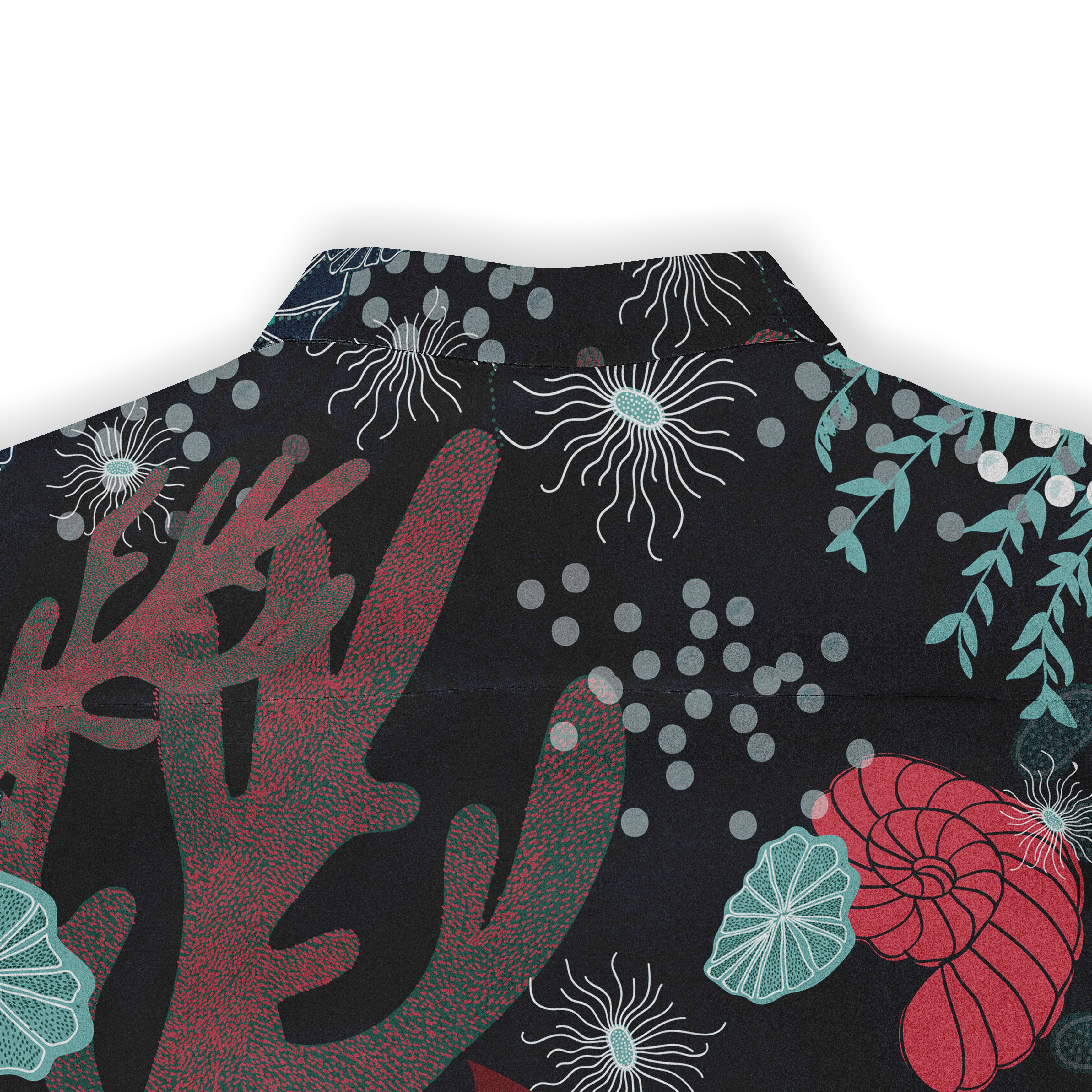 Close-up of the back of a Hawaiian shirt featuring coral patterns, marine life, and bubble details on a dark background.