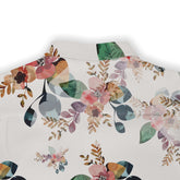 This image features the back collar area of a Hawaiian shirt with a delicate floral design. The pattern includes watercolor-style flowers and leaves in various shades of pink, green, and brown on a white background, creating a soft and elegant look.