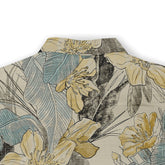 Back view of a Hawaiian shirt featuring a detailed floral design with yellow flowers, blue leaves, and black accents on a beige background, highlighting the elegant and intricate pattern.