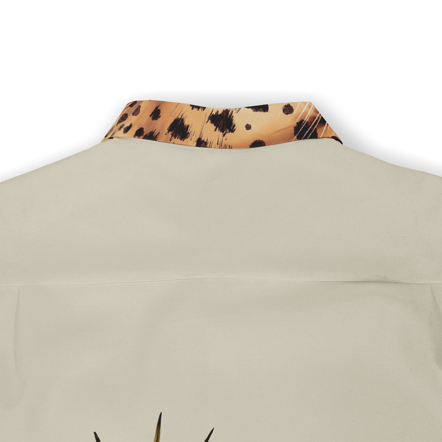 Embrace elegance with a touch of the wild. This shirt features a sleek design with subtle leopard accents on the collar, adding a unique flair.