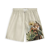 These stylish shorts feature a bold leopard design with tropical leaves, offering a unique blend of elegance and adventure. Perfect for a statement look.