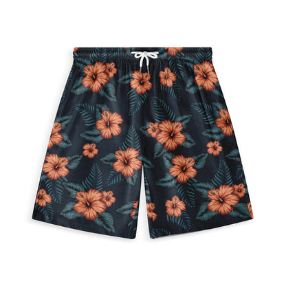 Shorts with an orange hibiscus flower and green leaf pattern on a dark background.