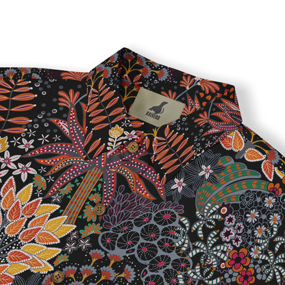 Shirt with a colorful floral pattern in orange, red, yellow, and green on a dark background.