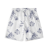 A pair of shorts with a delicate botanical design featuring various tropical leaves in shades of blue on a white background.