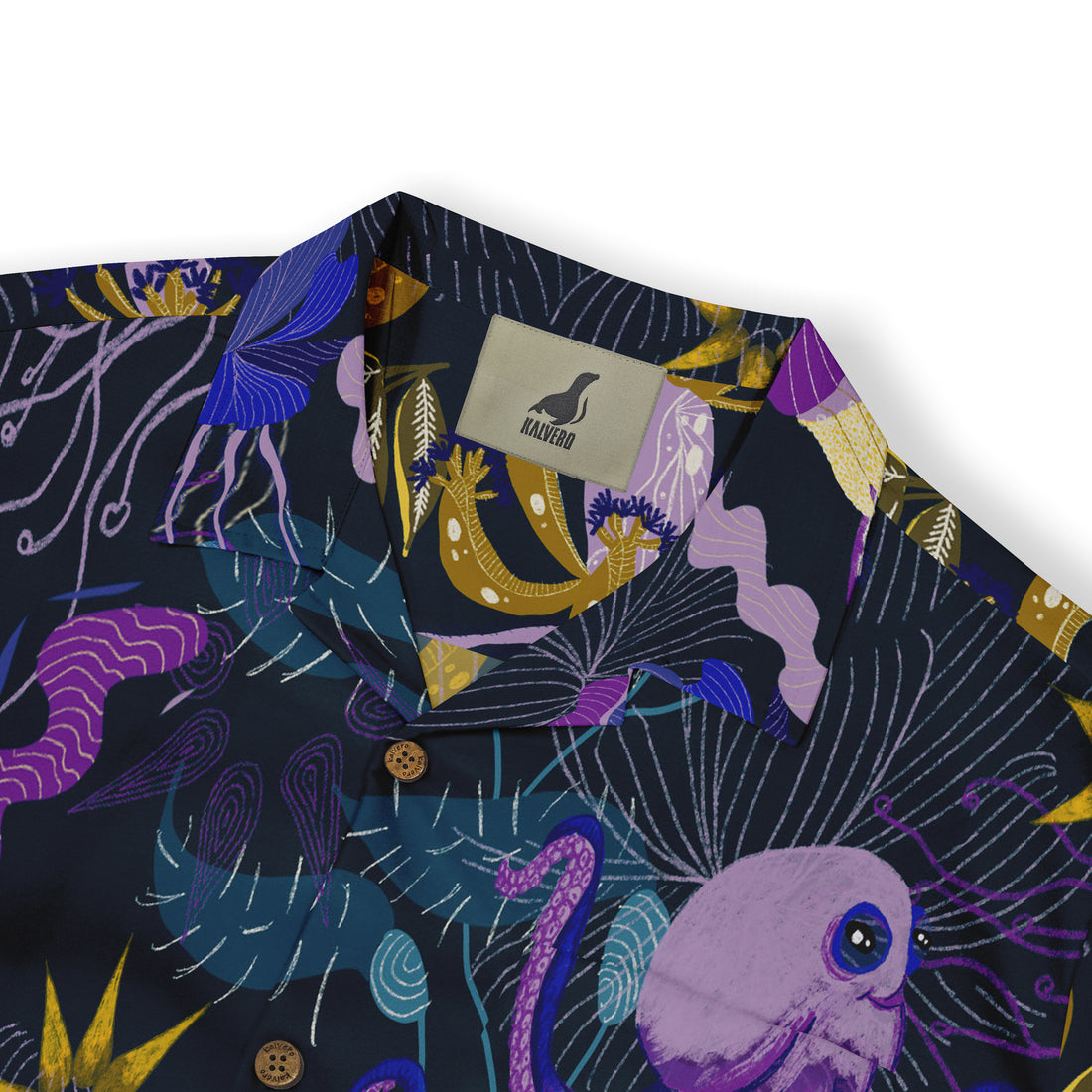 Close-up of a shirt collar with a marine-themed design, featuring detailed illustrations of sea life like jellyfish and seaweed in shades of purple, yellow, and blue on a dark background, with a visible “Kalvero” label.