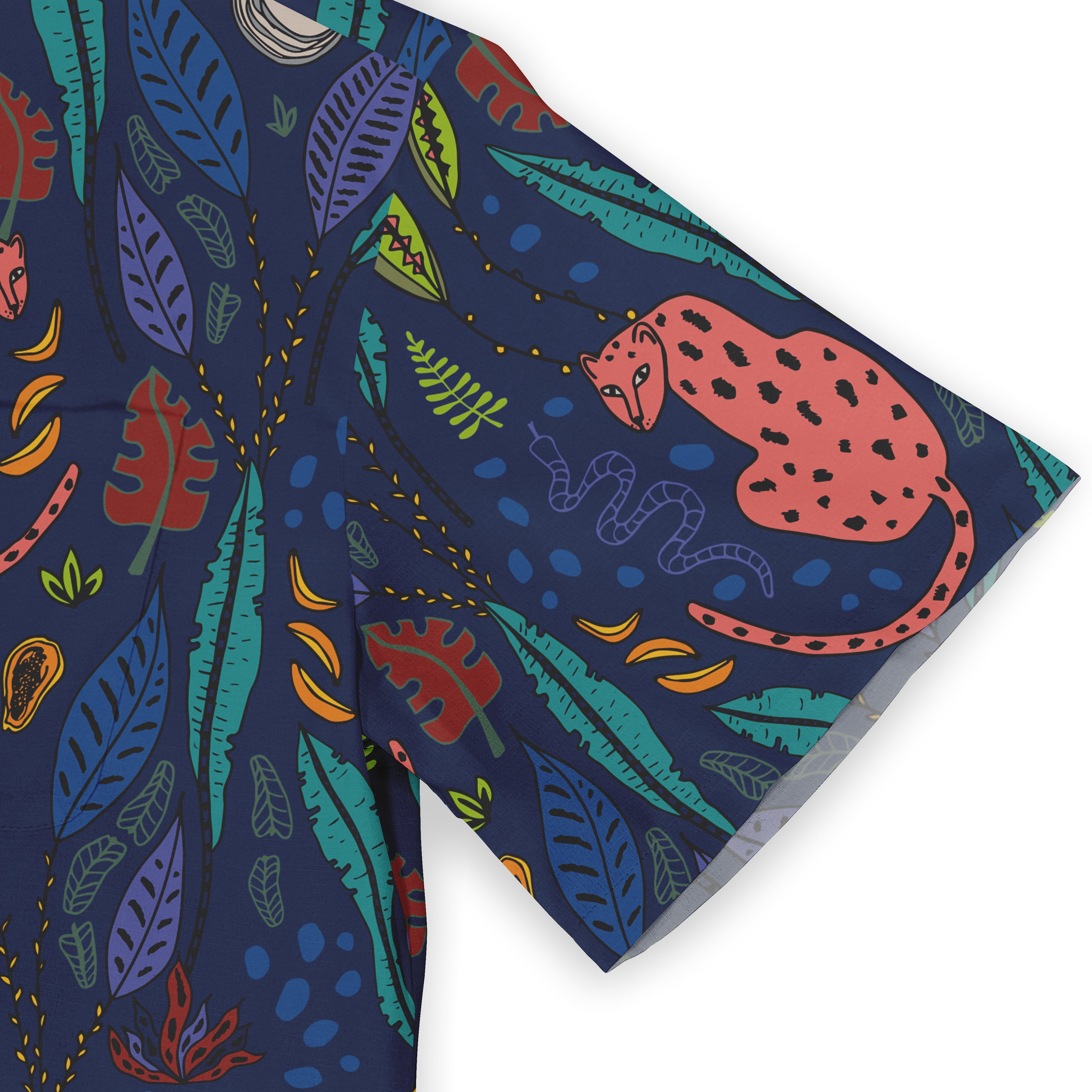 Close-up of a shirt sleeve with a vivid design featuring a pink leopard, colorful leaves, and abstract patterns on a deep blue background.