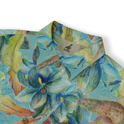 A close-up of a short-sleeve shirt collar showcasing a vibrant design of blue tropical flowers and sea turtles, highlighting the detailed and colorful pattern on the fabric.