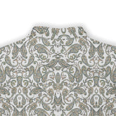 A short-sleeved shirt with a "Serenity Scrolls" pattern, featuring blue and white paisley motifs and floral vines framed by geometric borders back view