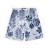 Pair of shorts with a blue and white tropical leaf pattern on a light background.