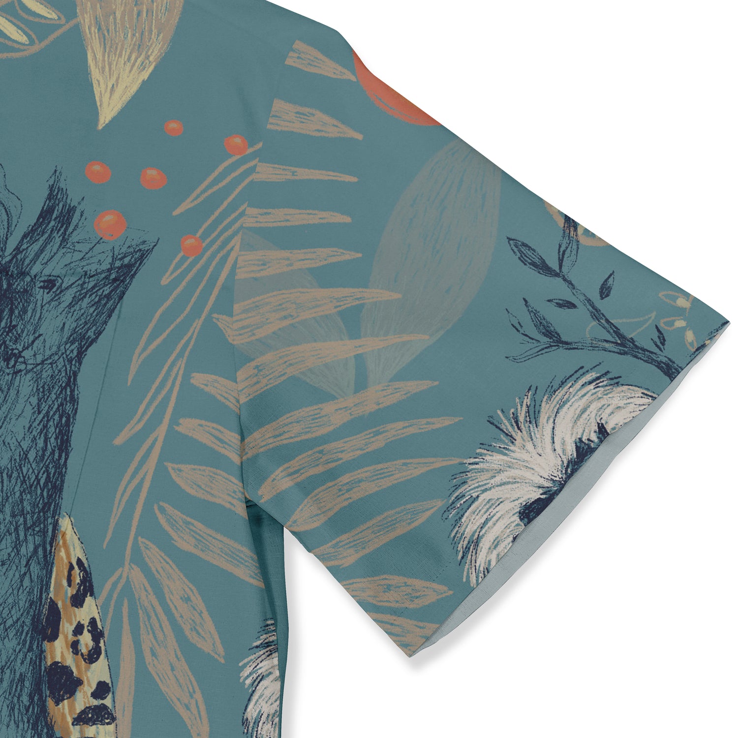 This image shows a detailed view of the shirt sleeve, featuring a jungle-inspired design with elements like leaves, branches, and abstract patterns in soft colors against a teal background.