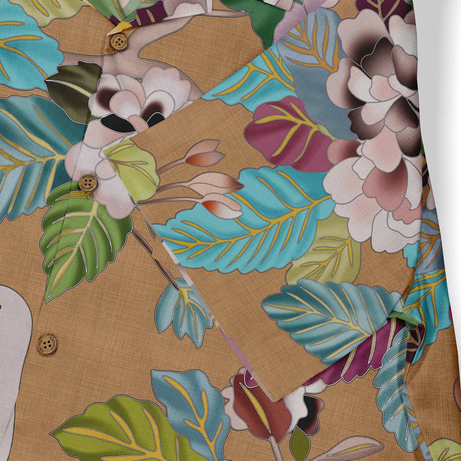 A close-up of a shirt featuring vibrant leaves and flowers in shades of green, blue, and purple against a beige background, capturing a lively and nature-inspired design.