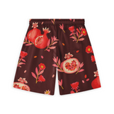 Back view of shorts with a pomegranate and floral pattern in red and pink tones on a deep burgundy background.