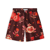 Shorts featuring a pomegranate and floral pattern in red and pink tones on a deep burgundy background, with a drawstring waist.