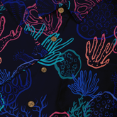 Close-up of a Hawaiian shirt pocket with a vibrant coral reef pattern in neon colors on a dark background, featuring brown buttons.