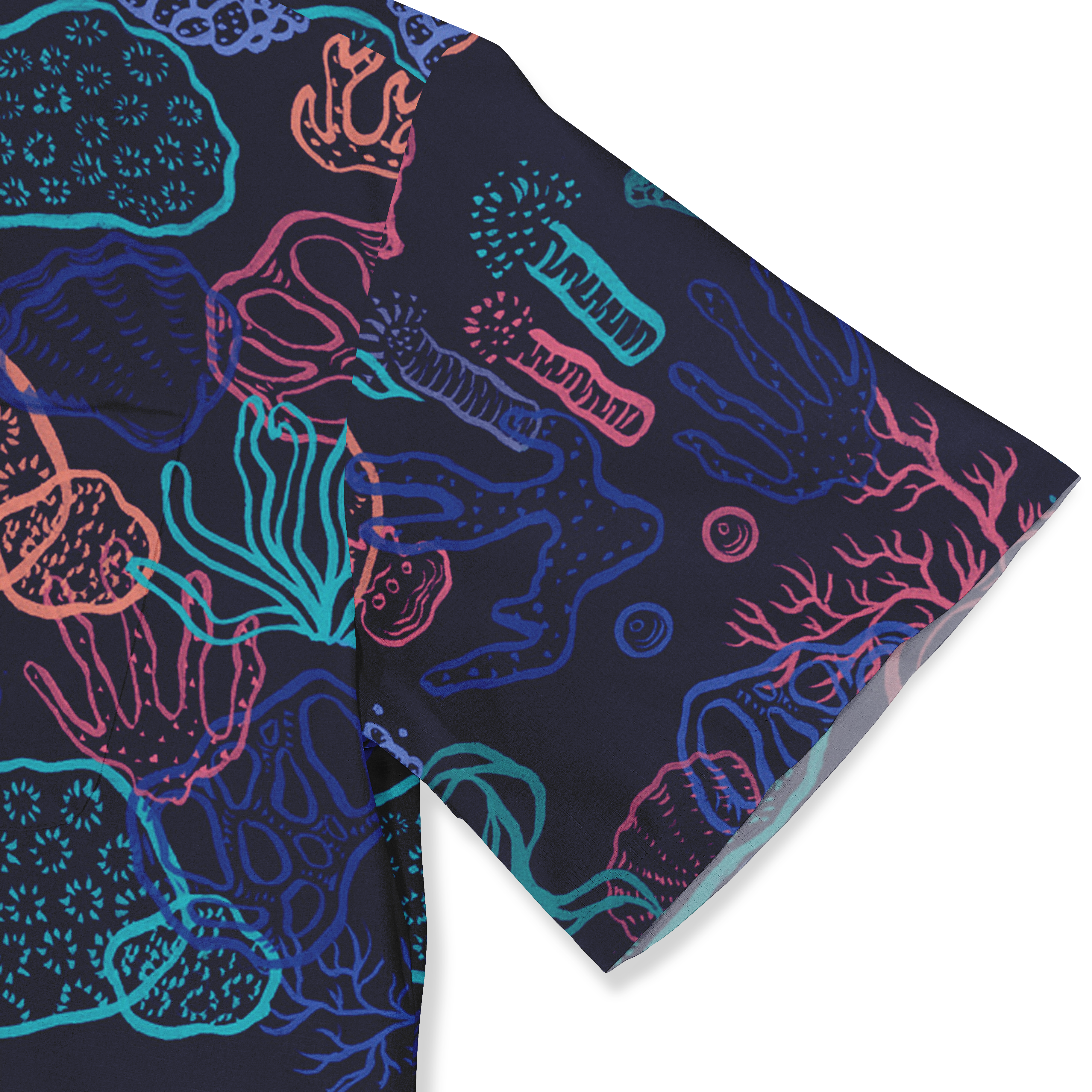 Close-up of a Hawaiian shirt sleeve with a vibrant coral reef pattern in neon colors on a dark background.