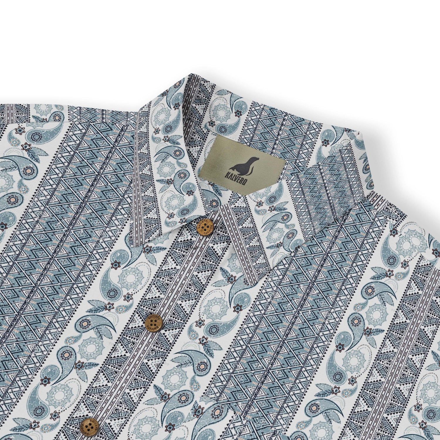 A short-sleeved shirt with a &quot;Serenity Scrolls&quot; pattern, featuring blue and white paisley motifs and floral vines framed by geometric borders front view