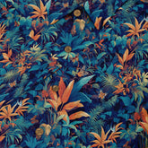 Dark teal shirt with vibrant tropical flowers and foliage, evoking a tropical paradise close-up