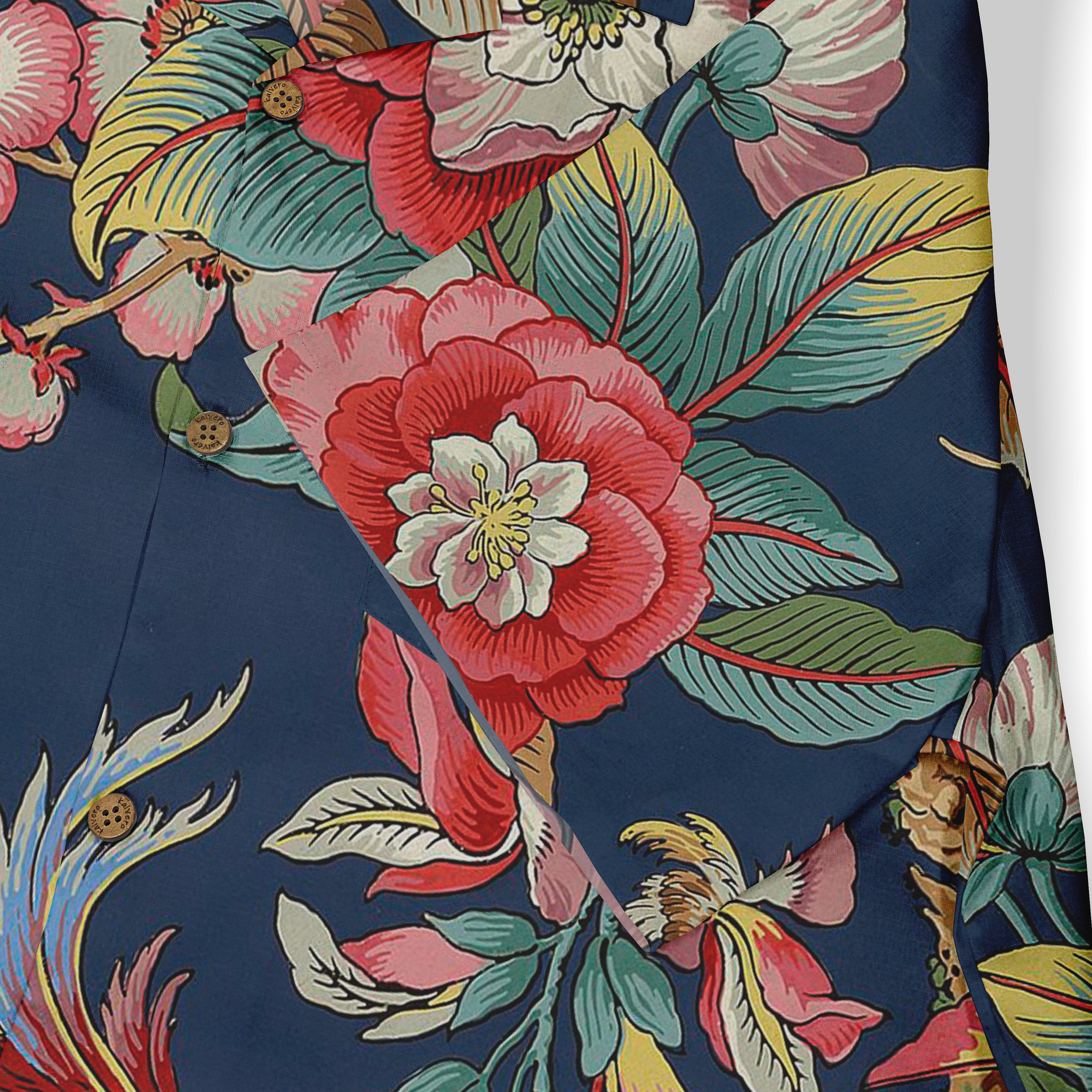 Close-up of a shirt design featuring bold, vibrant floral patterns with red and white flowers, green and yellow leaves, and intricate detailing on a deep blue background.