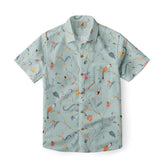 Light green shirt with a delicate floral design, featuring thin branches, colorful flowers, and small birds, creating a soft and elegant look.