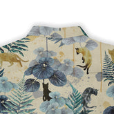 This is a close-up of the back of a shirt featuring a nature-inspired design with detailed botanical elements and leopard motifs in shades of blue, green, and beige, set against a textured, earthy background. The design includes large leafy plants and various leopard silhouettes, creating a harmonious blend of natural and wild themes.